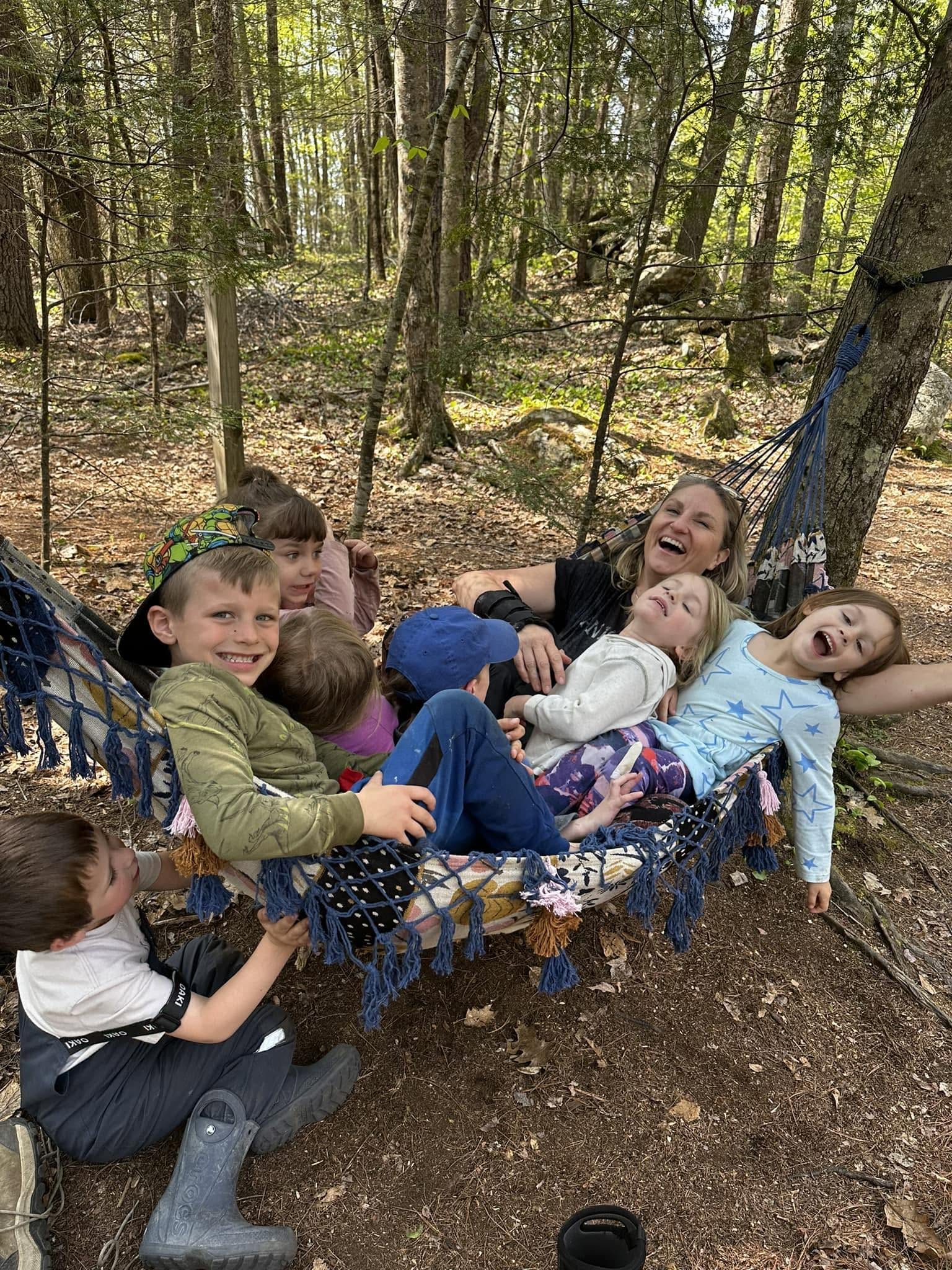 Dawn and a hammock full of laughing kids in the woods